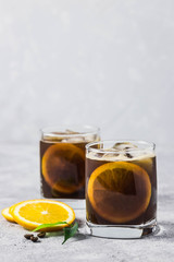 Orange spiced iced coffee. Selective focus, space for text.