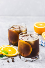 Orange spiced cold brew coffee. Selective focus, space for text.