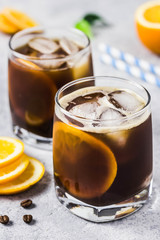 Summer refreshing orange iced coffee. Selective focus, space for text.