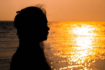 Silhouette of a girl face in the evening