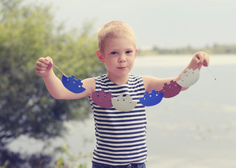 children's stylized birthday in nature outdoors in the style of pirates decor for kid. boys brothers in sea pirates costumes. candy bar decorations