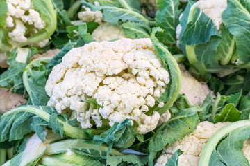 Fresh vegetables cauliflower inflorescences on the market counter
