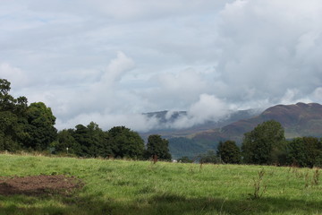 Fototapeta premium Loch Lomomd highlands in Scotland view of mountins behind