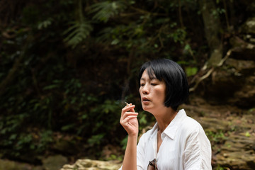 traveling woman smoking and resting