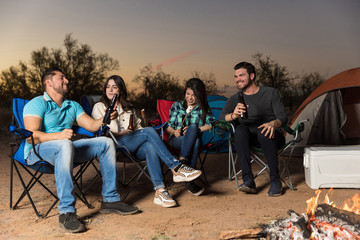 Couples Having Fun Near The Bonfire