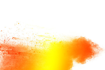Yellow orange color powder splatter on white background. Color particles splash