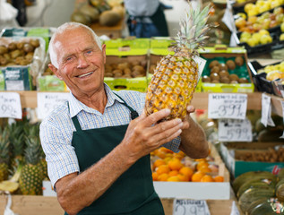 Salesman offering fresh fruits and vegetables
