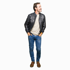 Middle age handsome man wearing black leather jacket looking away to side with smile on face, natural expression. Laughing confident.