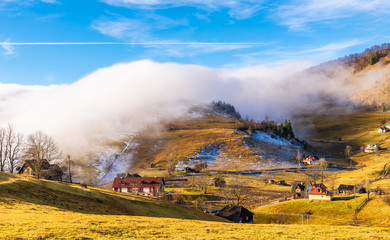 Fototapeta na wymiar Rural landscape with fog in Sirnea – Fundata village, Transylvania landmark, Romania
