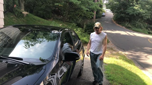 Man getting in a car