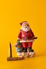 Concept New Year crime. Santa and bullets