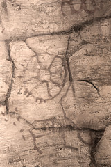 image of ancient people on the wall of the cave. history of antiquities, archaeology.