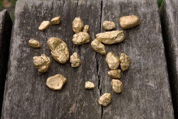Pure gold ore on old wood	