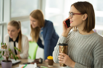 Young woman working at the office