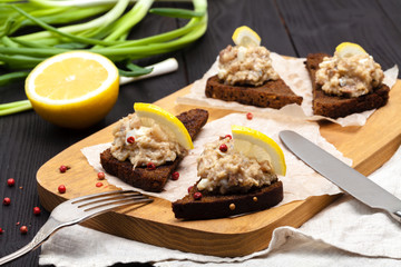 minced herring fillet with apple and egg on toasted rye bread, homemade traditional Jewish cuisine dish forshmak, snack or appetizer