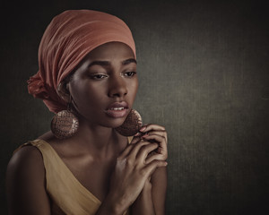 African beauty. Beautiful female portrait with ethnic dress and decorations