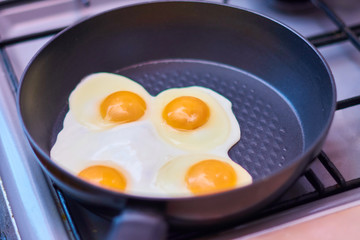 fried eggs in a frying pan