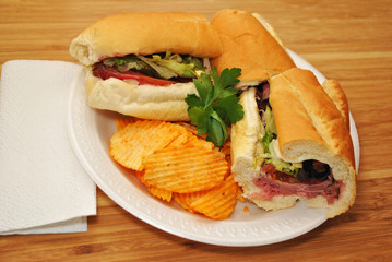Roastbeef Sub Sandwich Served on a Plate with Chips 