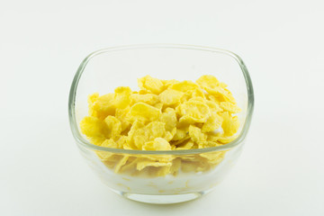 Bowl of corn flakes on white isolated background