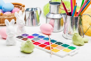 painted decorative easter eggs, brushes, palette and paints