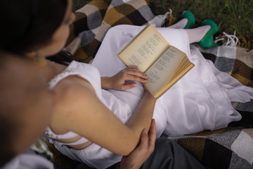 young woman reading a book