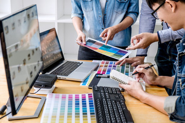 Young creative team having a meeting in creative office, Architectural drawing with work tools and...