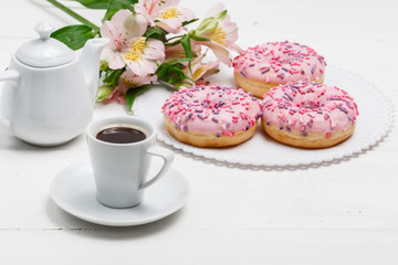 Coffee for breakfast with glazed donuts
