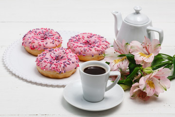 Coffee with glazed donuts, light breakfast snack