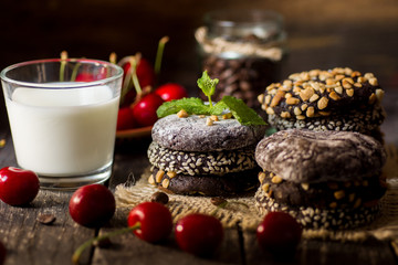 different types Brownie Cookies and table setting Sweet biscuits in dark. Homemade pastry 