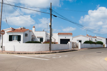 Fototapeta na wymiar White houses of a little village of Minorca island