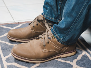 closeup mans shoelaces tied together, April fools day