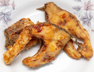 Fish fried in a pan in oil