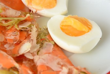 halved chicken eggs and vegetables in jelly