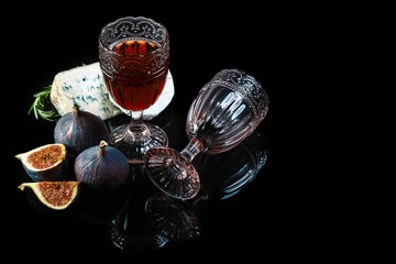 Wine and cheese still life. Food background. Top view. Copy space