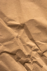 Texture of brown craft paper. Vertical photo.