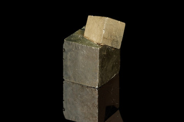 Macro mineral stone Pyrite on a black background