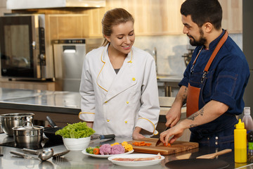 Professional chef and his assistant at the kitchen