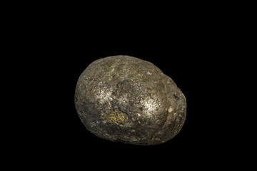 Macro mineral stone Pyrite on a black background