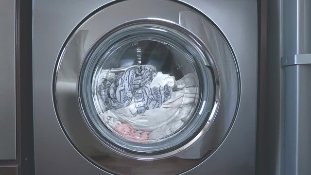 Stainless steel front loading washer close up