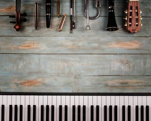 Tuinposter musical instruments in wooden background © xavier gallego morel
