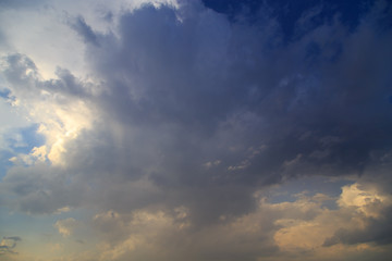 Clouds after rain before sunset as a background