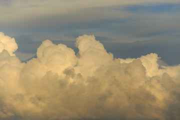 Clouds after rain before sunset as a background