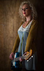 Woman playing electric guitar, vintage grunge Grunge rock style setting
