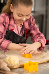 Fototapeta na wymiar Little cute girl baking at home