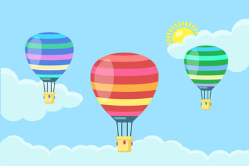 Fototapeta premium Hot air balloon in the sky with clouds isolated on blue background. Set of aerospace with basket. Flat cartoon design. Vector illustration.