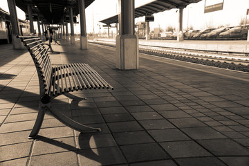 Empty train station, iron chair or bench in empty platform.