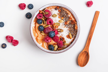 Delicious smoothie bowl with berries and dryed coconut.
