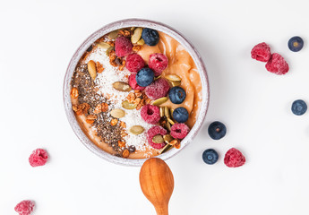 Delicious smoothie bowl with berries and dryed coconut.
