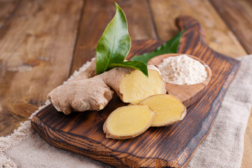 Ginger and lemon on a wooden background, Photo in a rustic style. Ingredients for warming and health drink. Alternative medicine. Free space for text.