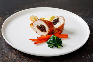 Chicken balmoral stuffed with black pudding, carrots, spinach and jerusalem artichokes